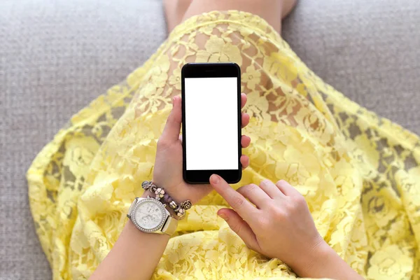 Woman in yellow dress with jewelry holding phone isolated screen — Stock Photo, Image