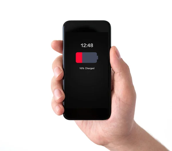 Na białym tle męskiej ręki trzymającej czarny telefon rezygnować niski naładowanej baterii — Zdjęcie stockowe
