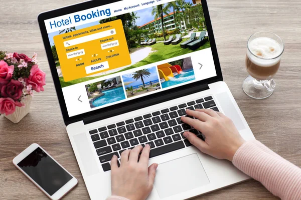 Woman hands on laptop keyboard with online search booking hotel — Stock Photo, Image