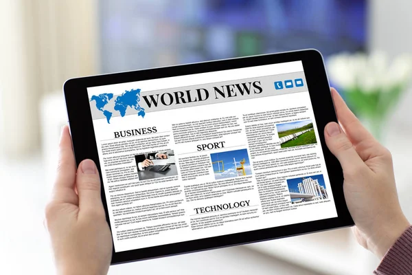 Female hands holding tablet with app world news on screen — Stock Photo, Image