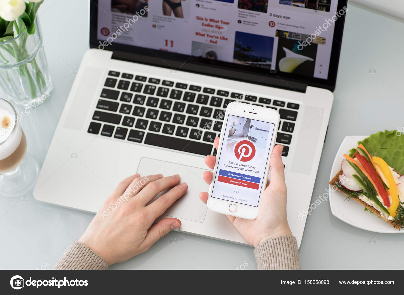 Woman hand holding iPhone with social Internet service Pinterest ...