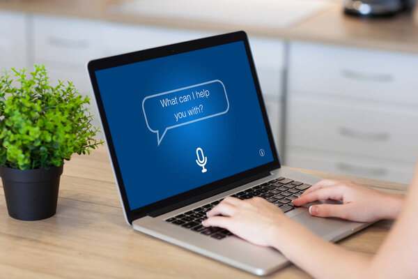 woman hands laptop with app personal assistant screen in room 