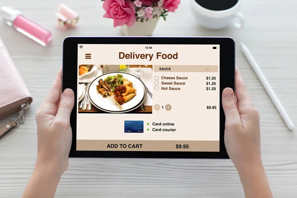 Woman hands holding tablet computer with app delivery food scree — Stock Photo, Image