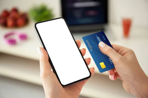 Female hands holding phone with isolated screen and credit card — Stock Photo, Image