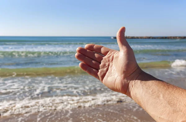 The inviting gesture of a man\'s hand