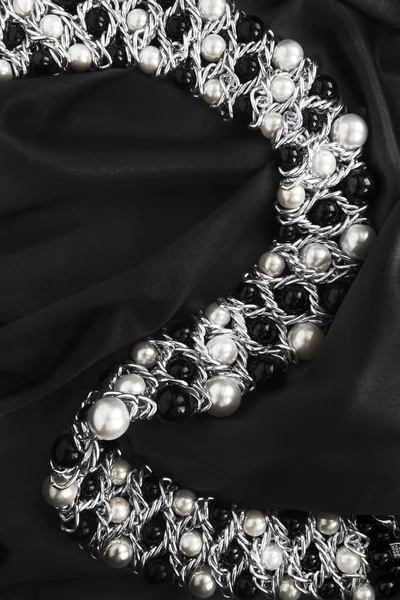 Necklace on silk — Stock Photo, Image