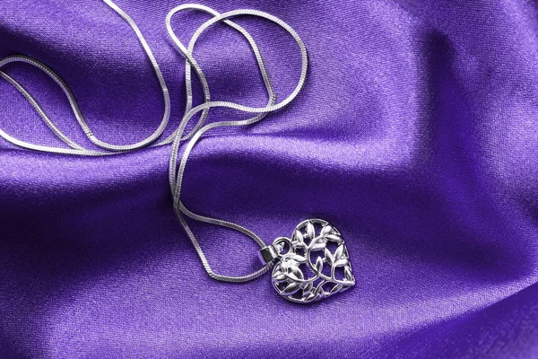 Necklace on satin — Stock Photo, Image
