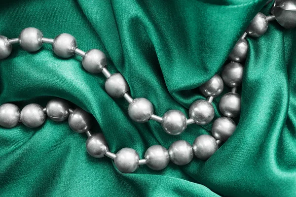 Beads on satin — Stock Photo, Image