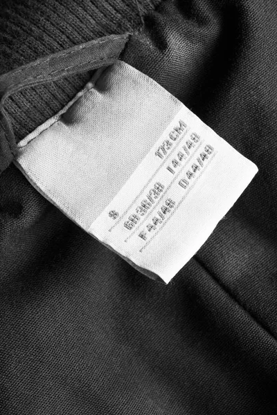 Bokstäverna kläder etikett — Stockfoto