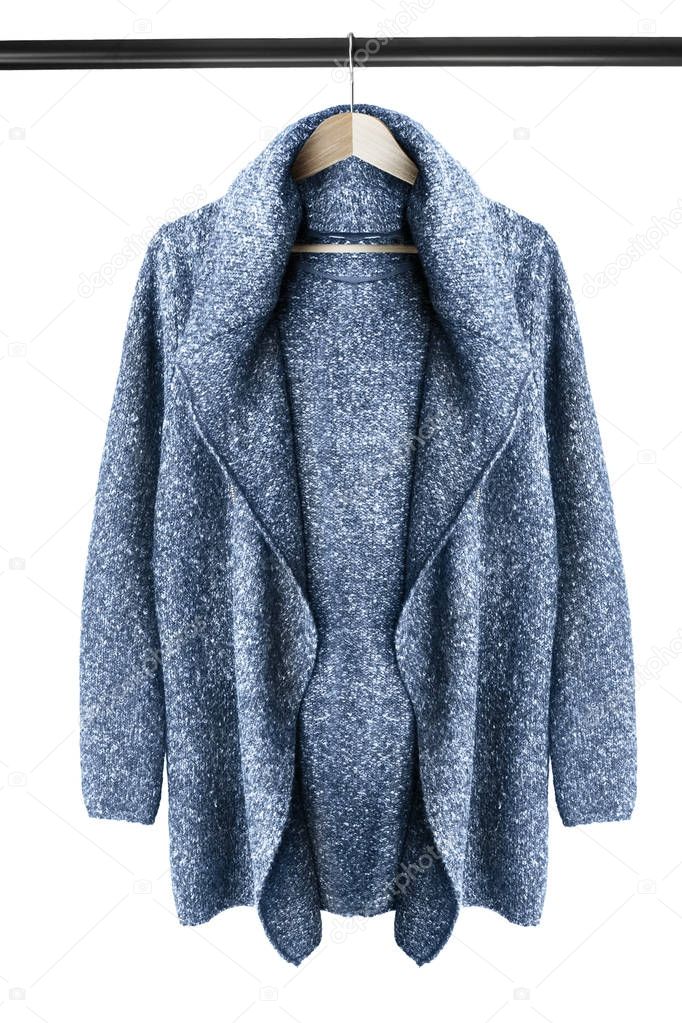Cardigan on clothes rack