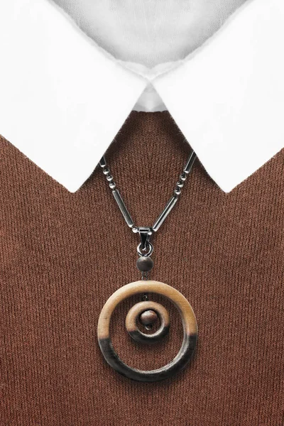 Necklace on shirt — Stock Photo, Image
