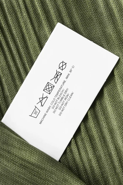 Zorg kleding label — Stockfoto