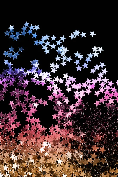Stars confetti on black — Stock Photo, Image