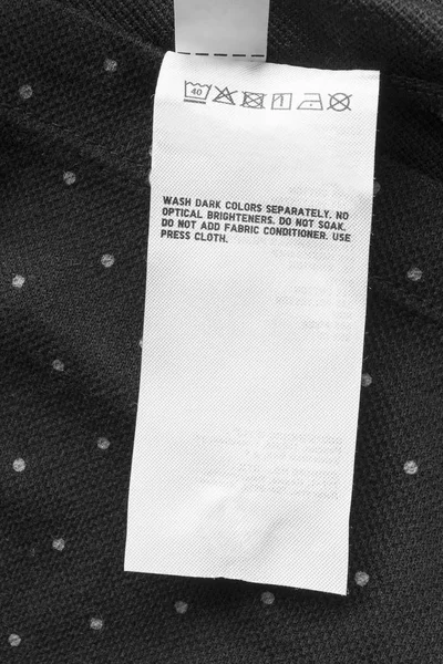Cuidado Etiqueta Ropa Negro Con Lunares Fondo Textil Primer Plano — Foto de Stock