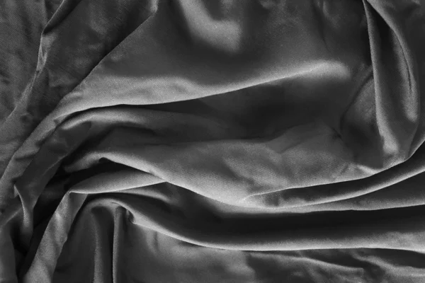 Black crumpled satin background — Stock Photo, Image