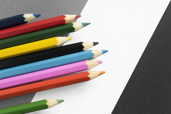 Colorful pencils and paper — Stock Photo, Image