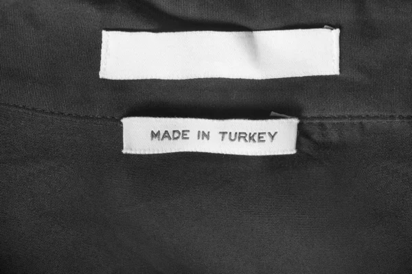 Etiqueta de roupas têxteis — Fotografia de Stock