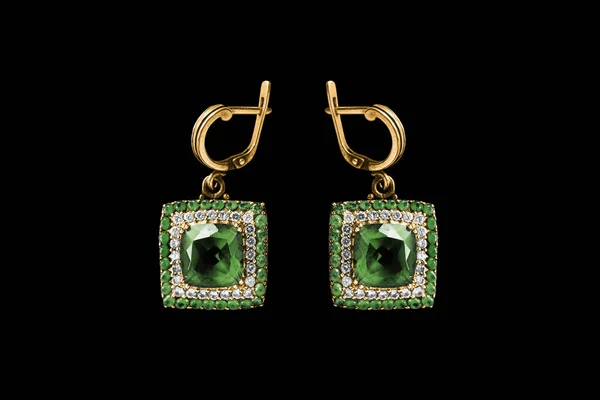 Emerald earrings on black — 스톡 사진