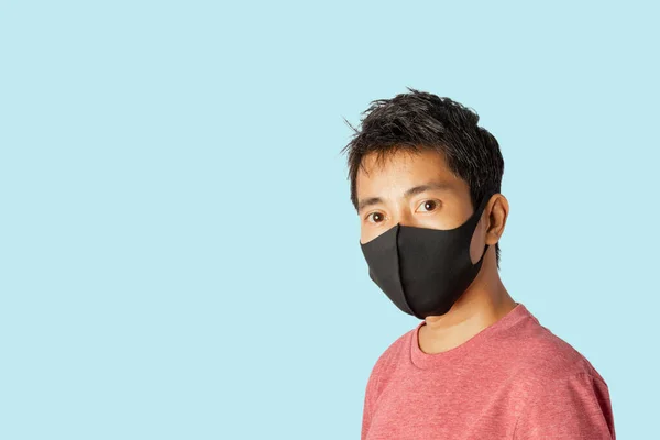 Close Young Male Wearing Protective Face Mask Blue Background — Stock Photo, Image