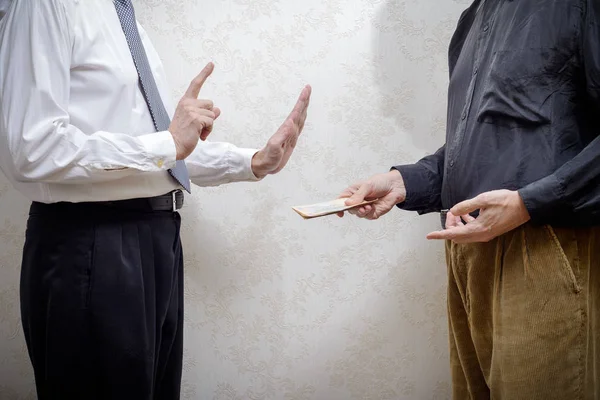 Man Offering  a Hryvnia Bribe to a Man Refusing It — Stock Photo, Image