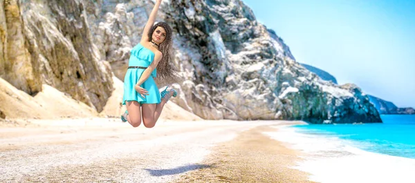 3D render beautiful woman light Aqua Menthe dress sea beach.Rocky coast clear white sand.Summer rest.Blue ocean background.Sunny day.Conceptual fashion art.color trend of the year