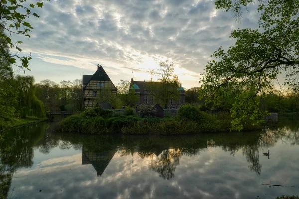 Sunrise over a medieval moated castle in Gladbeck in Germany