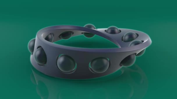 3D animation of a geometric figure, a Mobius tape having holes and glass balls in the holes. 4K animation for screensavers and banners. — Stock Footage Animation Geometric Figure Mobius Tape Having Holes Glass Balls Holes Stock Video
