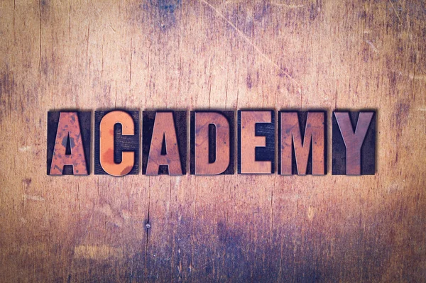 Academy Theme Letterpress Word on Wood Background — Stock Photo, Image