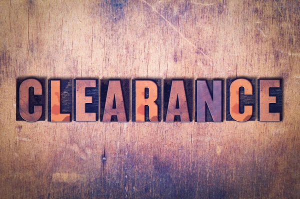 Clearance Theme Letterpress Word on Wood Background — Stock Photo, Image