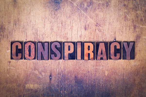 Conspiracy Theme Letterpress Word on Wood Background — Stock Photo, Image