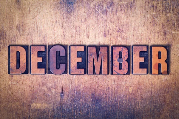 December thema boekdruk Word op houten achtergrond — Stockfoto