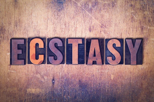 Ecstasy tema Letterpress Word su sfondo di legno — Foto Stock
