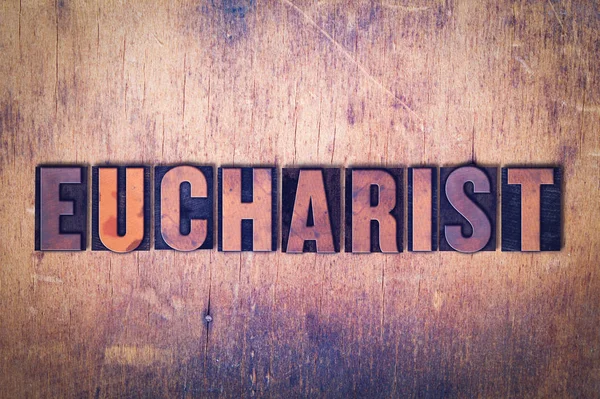 Ahşap arka plan üzerinde Eucharist Tema Letterpress kelime