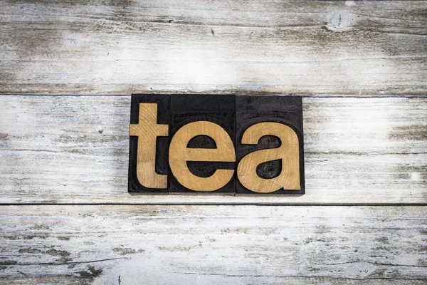 Palabra de tipografía de té sobre fondo de madera —  Fotos de Stock