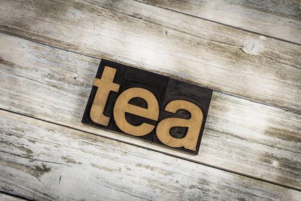 Palabra de tipografía de té sobre fondo de madera —  Fotos de Stock