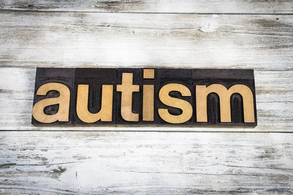 Autismo Letterpress Word su sfondo di legno — Foto Stock