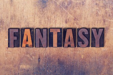 Fantezi Tema Letterpress Word ahşap arka plan üzerinde
