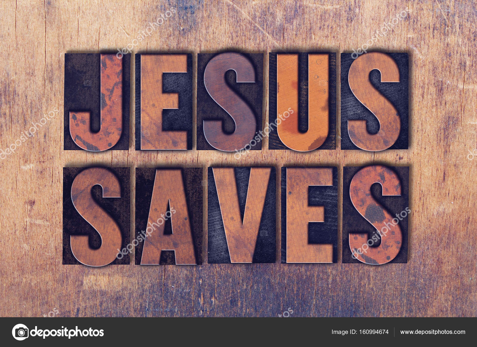 Jesus Saves Theme Letterpress Word on Wood Background Stock Photo by