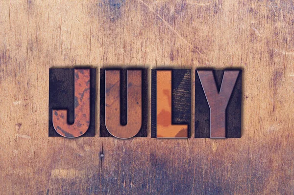 July Theme Letterpress Word on Wood Background — Stock Photo, Image