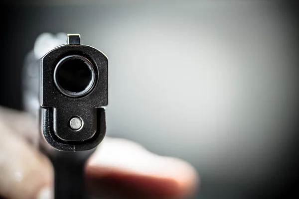 Hand Pulling the Trigger of a Hand Gun Pistol — Stock Photo, Image