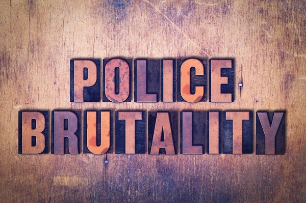 Police Brutality Theme Letterpress Word on Wood Background