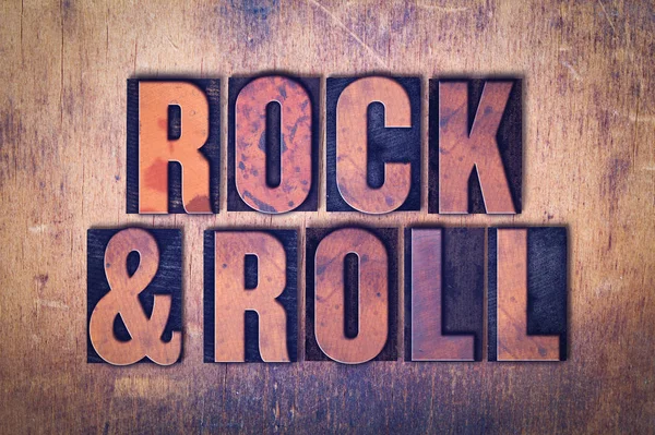 Tema Rock and Roll Letterpress Word on Wood Background —  Fotos de Stock