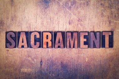 Sacrament Tema Letterpress Word ahşap arka plan üzerinde