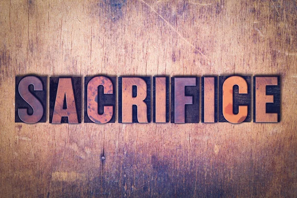 Sacrifice Theme Letterpress Word on Wood Background — Stock Photo, Image