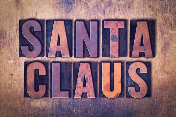 Santa Claus tema boktryck Word på trä bakgrund — Stockfoto