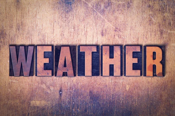 Väder tema boktryck Word på trä bakgrund — Stockfoto