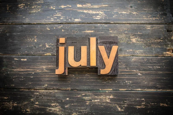 Word July Written Vintage Wood Letterpress Type Vintage Rustic Background — Stock Photo, Image