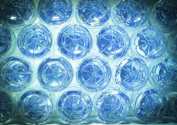 Rows of water in plastic bottles bottom — Stock Photo, Image