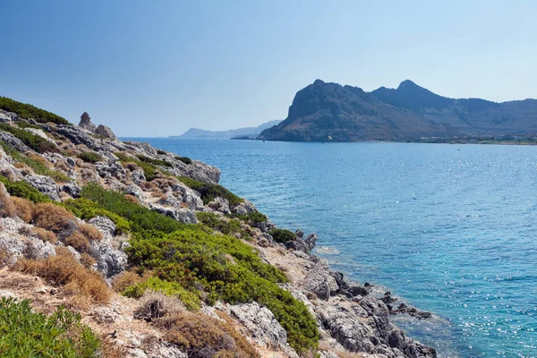 Kolymbia beach with the rocky coast in Greece. — Stock Photo, Image