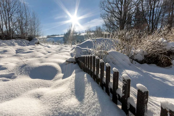 Orlicke Mountains - fence covered with snow with sun and blue sky — Stock Photo, Image